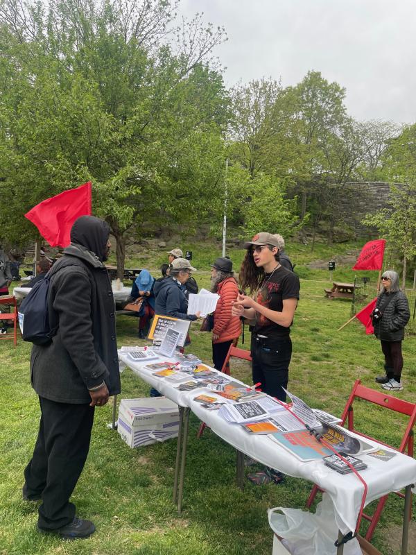 New York, Revolution Books table set up in a park at Revolutionary Internationalist May Day.