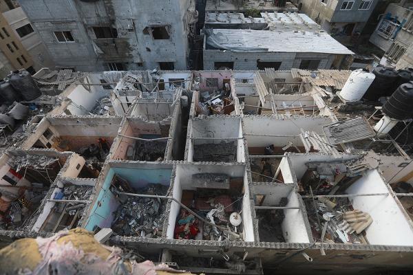 Palestinians inspect residential building in Rafah destroyed by Israeli airstrike, May 7, 2024.
