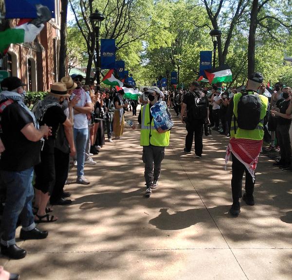 At DePaul University, Chicago, entrances are blocked and people are linking arms to protect encampment from anticipated Zionist counter protesters, May 12, 2024. 