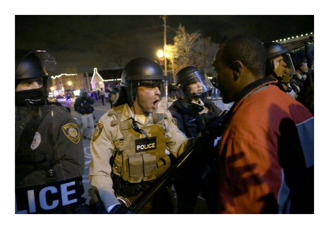Ferguson, 11/24: Ferguson protestor with cop. Photo: AP