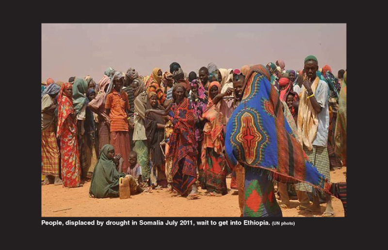 People, displayed by drought in Somalia in July 2011, wait to get into Ethiopia