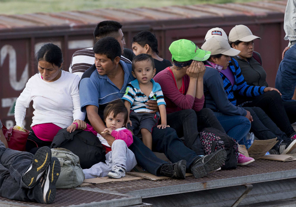 entral American family on a freight train heading toward the U.S.-Mexico border, 2014.