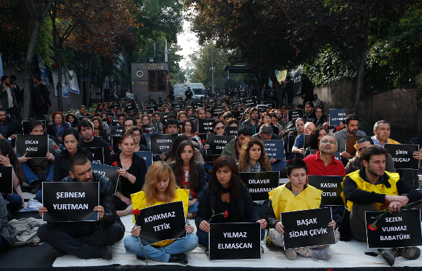 Ankara University students at a sit-in protest October 13, holding  placards with the names of those killed in the explosions.