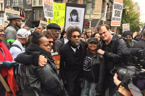 Eve Ensler, Carl Dix, Cornel West, and Quentin Tarantino march with families representing people murdered by police