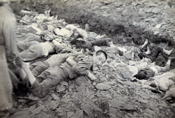 This U.S. Army photograph, once classified "top secret", shows a moment during the summary execution of 1,800 South Korean political prisoners by the U.S.-backed South Korean military at Taejon, South Korea, over three days in July 1950.