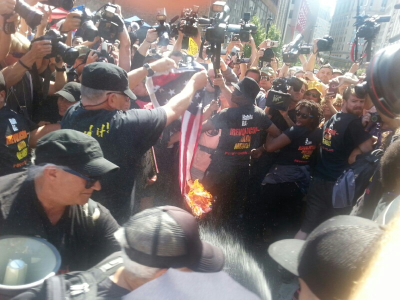 Joey Gregory Johnson burns American flag outside Republican Convention in Cleveland. He and 12 other Revolutionary Communists Arrested