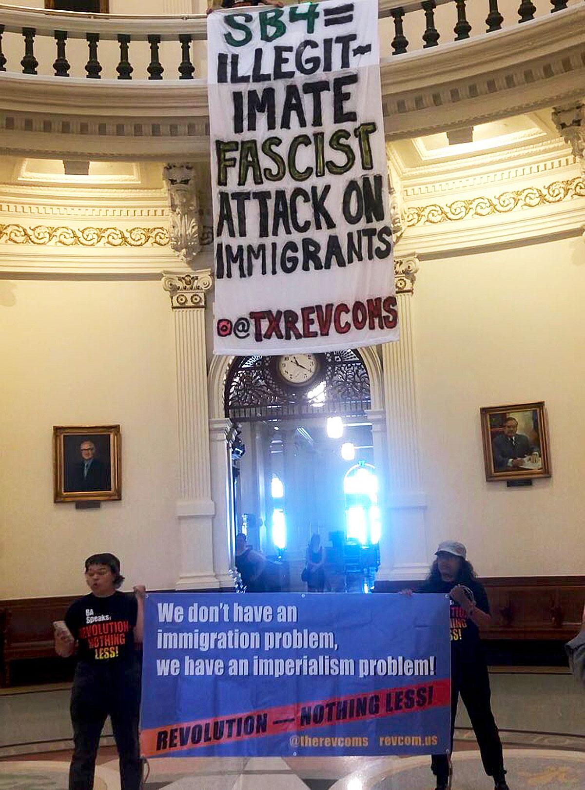 Banner drop in Austin, Texas capitol building says "SB4 Illegitimate Fascist Attack on Immigrants."