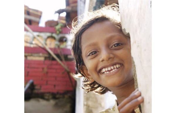 Girl in Sri Lanka grins at camera