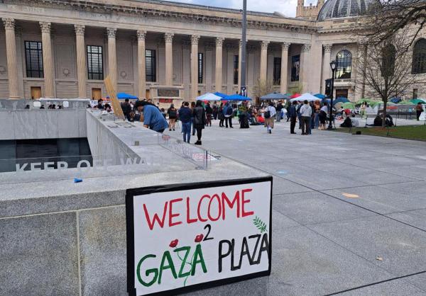 Yale University quad with a sign "Gaza Plaza" with students protesting for Palestine.
