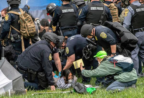 Cops with riot shields viciously dismantle encampment for Palestine at the University of Virginia, Charlottesville, May 4, 2024.