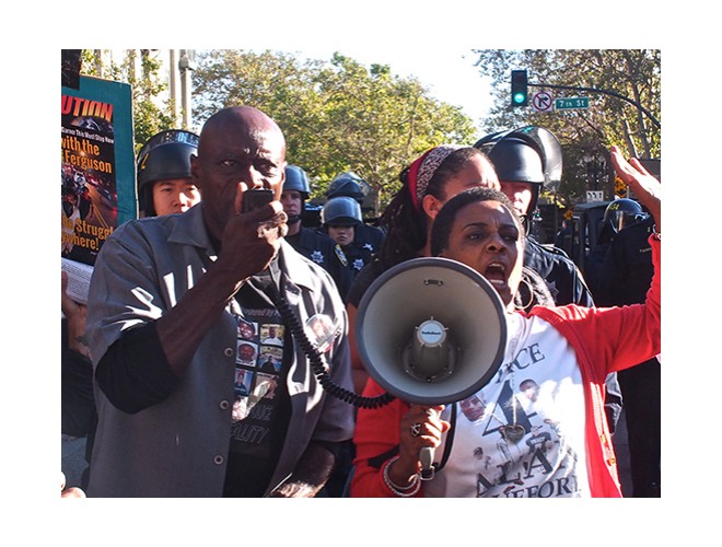 Cephus Johnson (uncle of Oscar Grant) and Jeralyn Blueford (mother of Alan Blueford) at Oakland, California 'Cease & Desist: It Ends Today' August 20, 2014.  Photo: Special to revcom.us