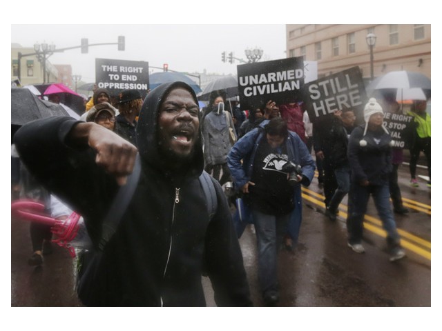 Oct 11: Defying rain and authorities in St. Louis to demand justice for Michael Brown.  Photo: AP