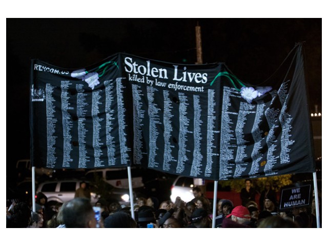 Oct 10: In the streets of Ferguson – “Stolen Lives Killed by Law Enforcement”.  Photo: Special to revcom.us
