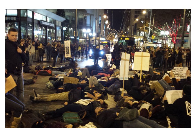 Seattle, 11/24: Protesters staging a die-in to block the streets. Photo: Special to revcom.us.