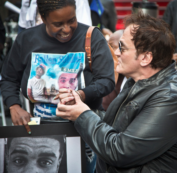 Quentin Tarantino meets Kimberly Griffin, whose son Kimoni Davis was killed by police, Times Square, October 22, at No More Stolen Lives: Say Their Names, A Public Reading and Remembrance--A Demand for Justice.