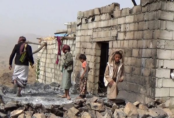 Residents inspect a house that was damaged during a January 29 U.S. raid on the tiny village of Yakla, in central Yemen.