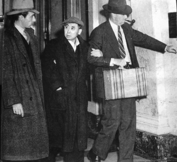 Japanese American community leader Sadiji Shiogi is lead away by FBI the day after the attack on Pearl Harbor.