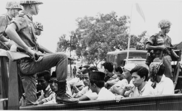 Members of the Youth Wing of the Indonesian Communist Party being taken to a Jakarta prison, October 30, 1965.