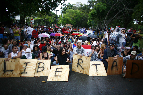 In 2010, students at the University of Puerto Rico blocked the main entrance to the Rio Piedras campus as part of a 2-day strike to protest budget cuts, a proposal to increase university fees and changes to the academic program.