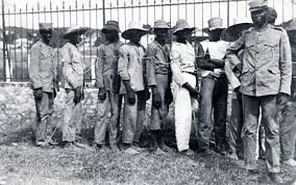 Haitian rebels are enslaved in ropes, 1915.