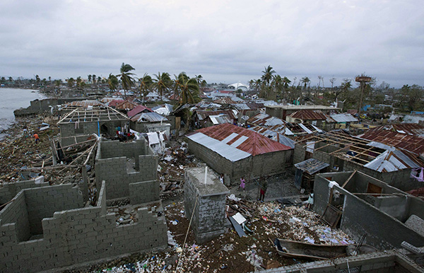 The main blow of Hurricane Matthew fell on the narrow Turibon Peninsula that stretches like a finger from Haiti’s southeastern border with the Dominican Republic west into the Caribbean Sea.  In Les Cayes, in this area, homes lay in ruins, October 6. (Photo: AP)