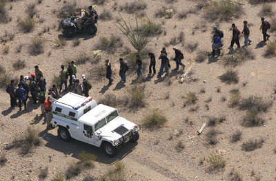 Three Points, Arizona, July 2004. Federal agents round up a group of suspected undocumented immigrants tracked by a Black Hawk helicopter.