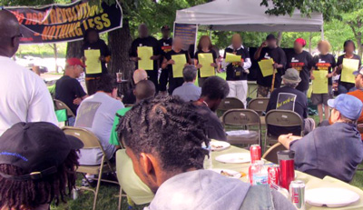 Chicago Rev Club member read from their proclamation to the community on fighting the real enemy and not turning against each other