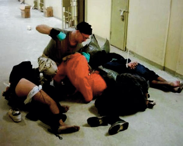 Abu Ghraib Prison, Iraq, 2003, U.S. Marines beat and torture prisoners