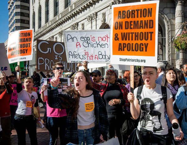 Spirited counter-protest against the 2015 "Walk for Life" in San Francisco, an annual woman-hating parade organized by a network of Catholic churches aimed at criminalizing abortion and imposing forced motherhood on women.