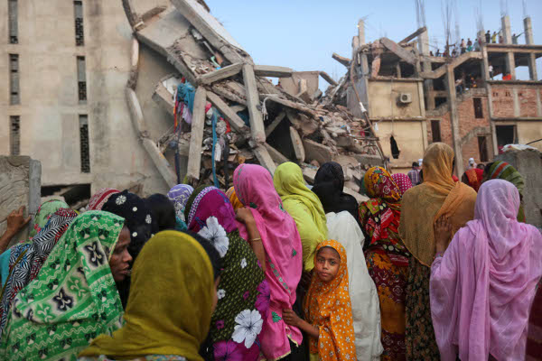 Relatives of missing workers wait hopefully for their loved ones at the collapsed factory site in Savar, Bangladesh.