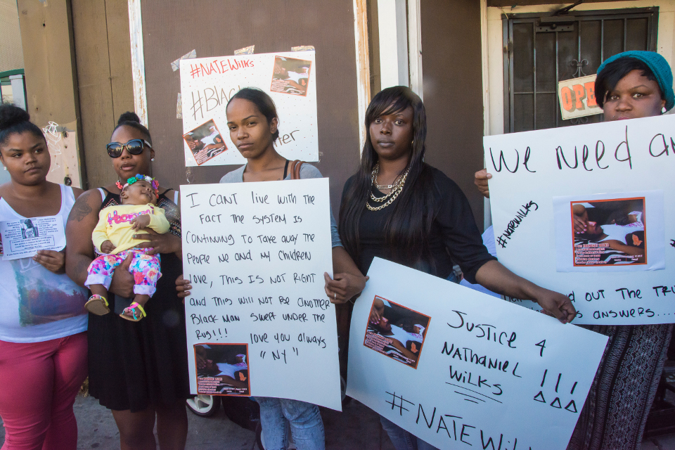 Wilks family at the vigil on August 14: Far left, Jasmine Marshall, Nate Wilks' sister-in-law; second from left, Wilks'spartner, Chemika Hollis and daughter Kai'lei