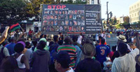 Red Parar la Encarcelación en Masa marcha en el desfile del Día de la Herencia Afroamericana en Harlem