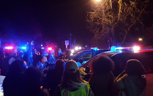 Confronting police at the scene where they shot Jamar Clark, an unarmed Black man. Photo: @McMcdowell397