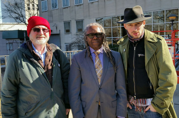 Clark Kissinger (left); Miles Solay (right); and their attorney Kenneth Gilbert.