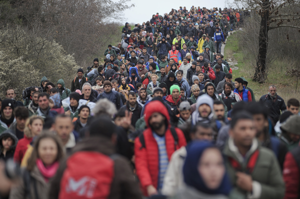 Thousands of refugees stranded in the Greek town of Idomeni try to find a route across the border to Macedonia.