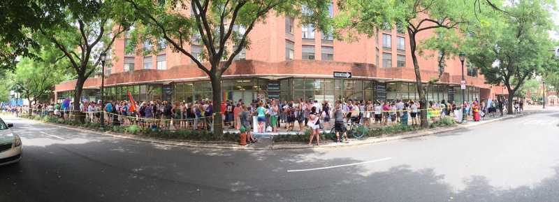 Hundreds form a Wall of Love to protect an LGBT service center from Christian fascists.