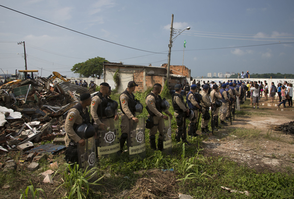 Rio de Janeiro police during a demolition of what remains of the Vila Autodromo slum, in Rio de Janeiro, Brazil, on March 8, 2016. 