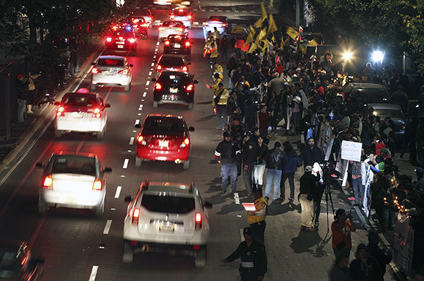 Drivers honk their horns to show support for demonstrators protesting outside the headquarters of the government-run PEMEX oil company in Mexico City, January 8.