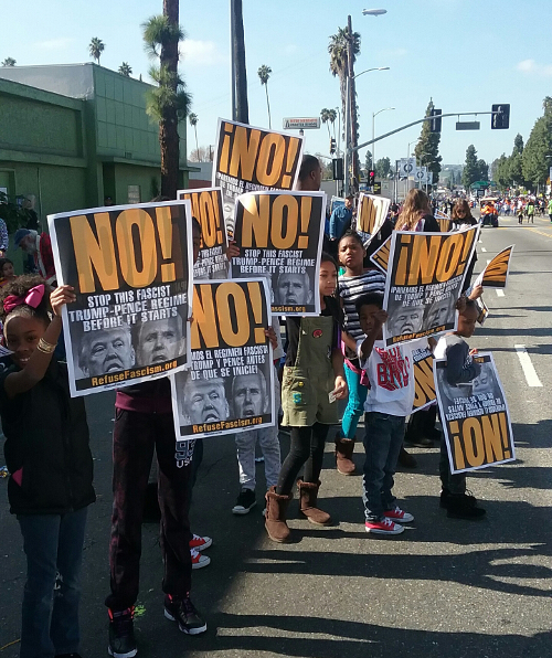 Hundreds of people along the MLK Day march took up the NO! posters from Refuse Fascism and expressed their hatred of the Trump-Pence fascists, Los Angeles, January 16.