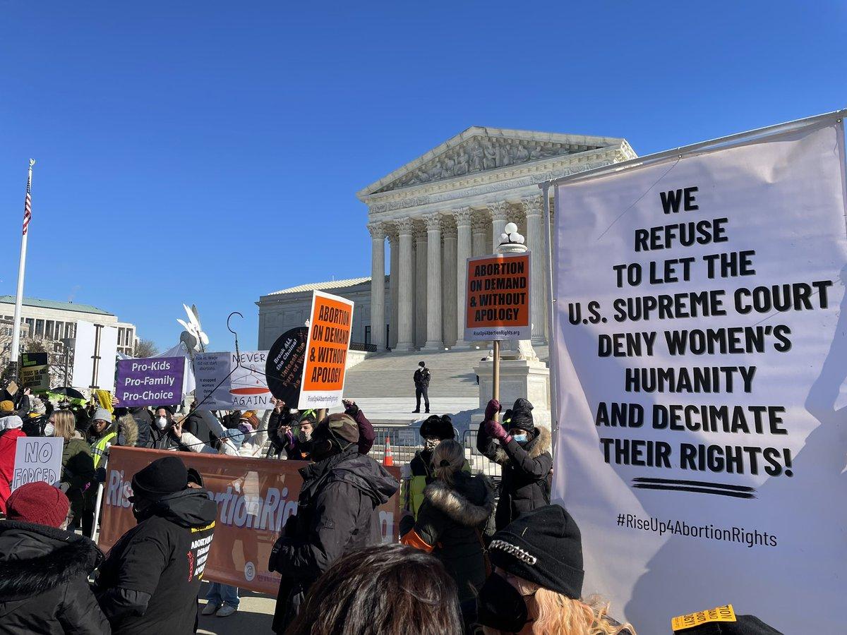 RiseUp4AbortionRights contingent at SCOTUS with banners.