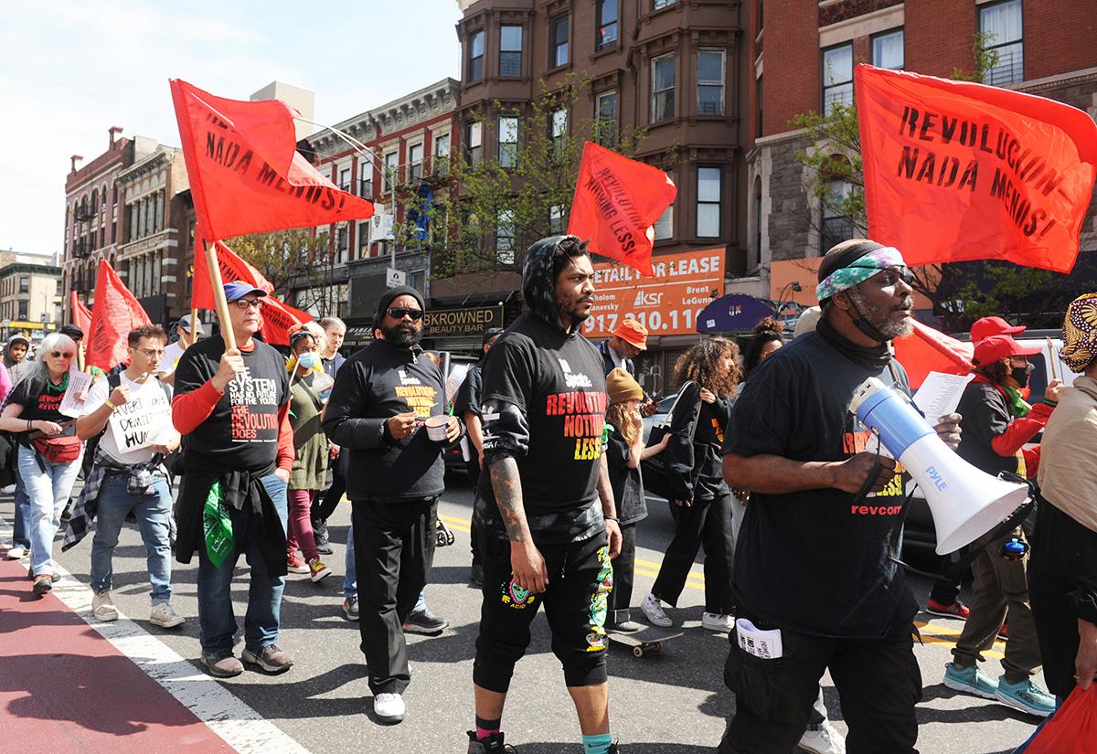 Rev Coms march in formation at May Day rally in New York City.