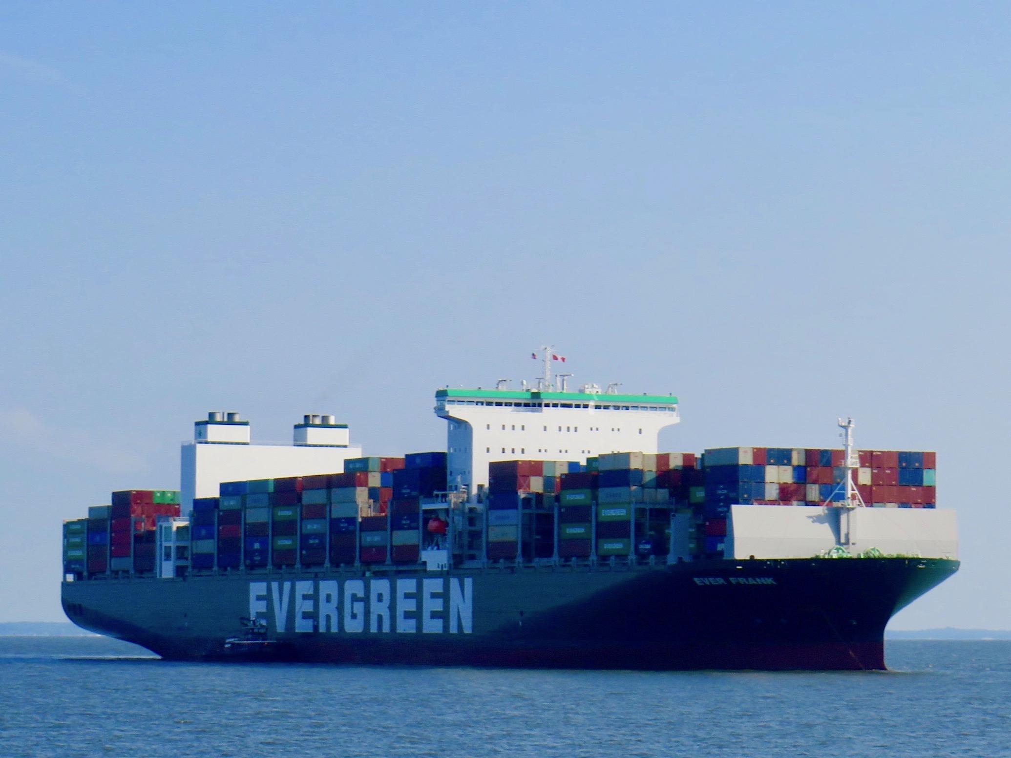 Tugboat guides massive containership arriving in NY-NJ harbor
