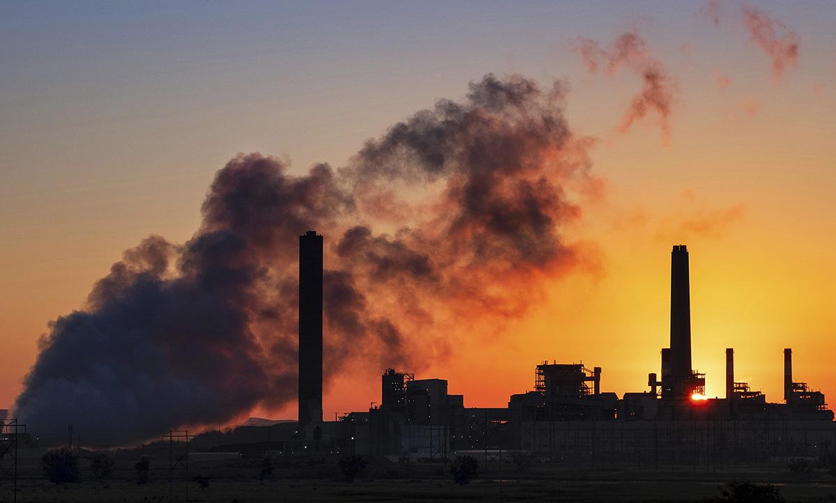 The Dave Johnston coal-fired power plant silhouetted against the morning sun in Glenrock, Wyoming.