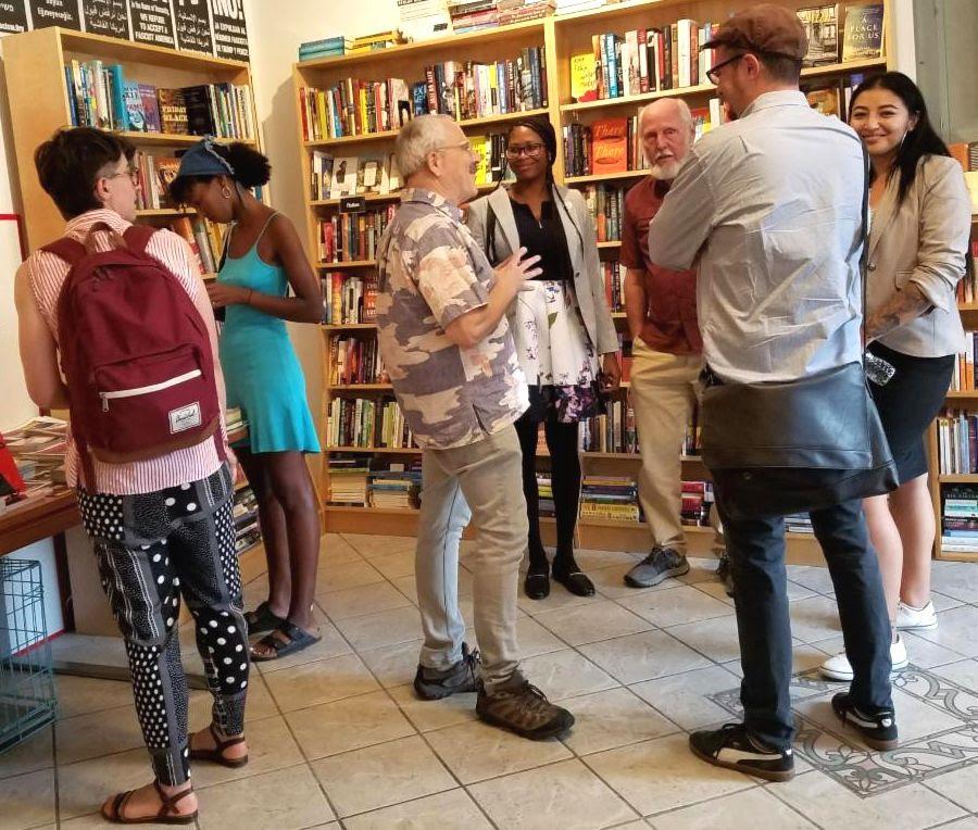 DIscussion continues after a program at Revolution Books, NYC