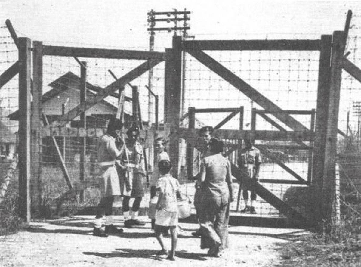 1952, heavily guarded (with barbed wire) "new village" near Ipoh, Perak.