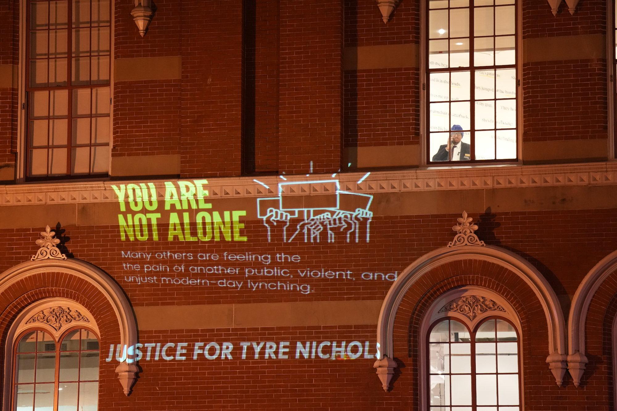 "You are not alone Justice for Tyre Nichols" wall projection protest in Washington DC