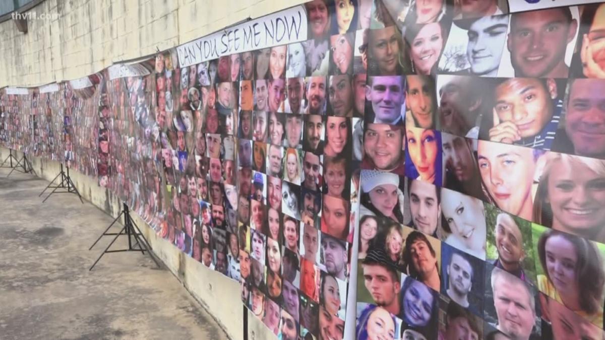 Row of banners with photos of people who have died of fentanyl overdoses