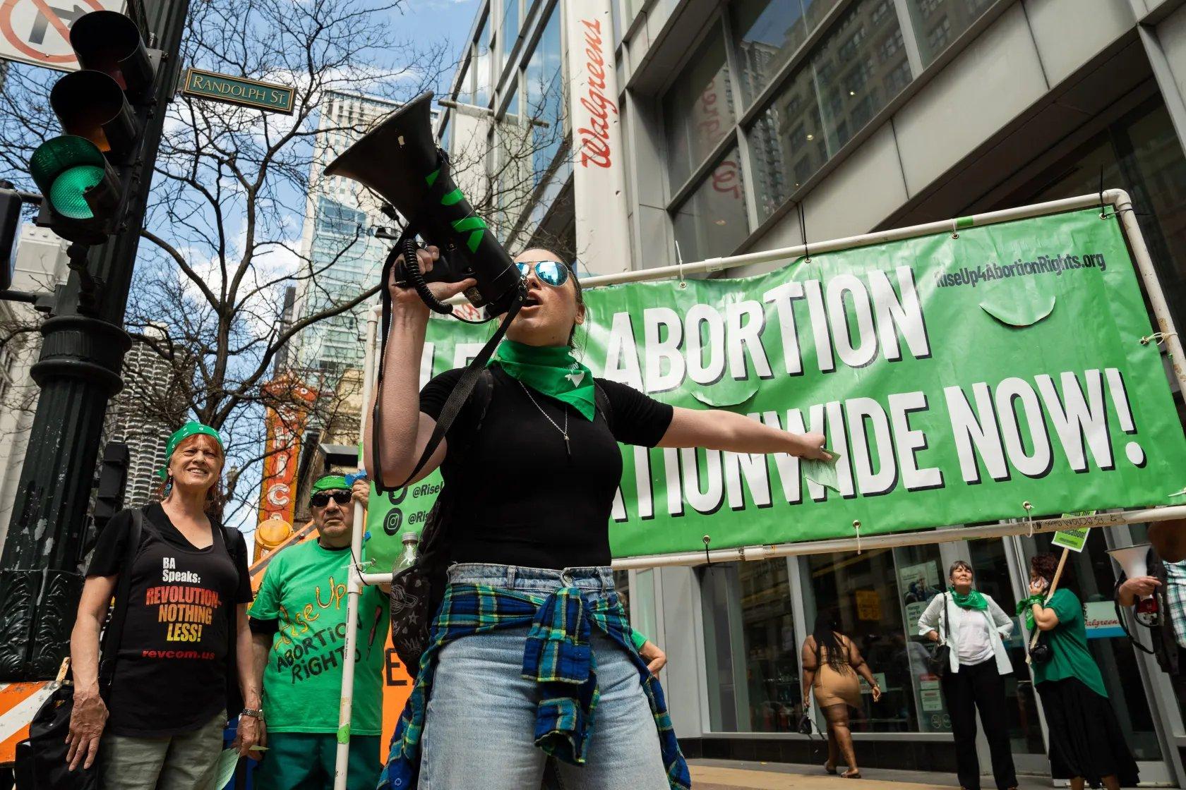 Rise Up 4 Abortion Rights Protest in front of Walgreens with banner "Legal Abortion Nationwide Now" 