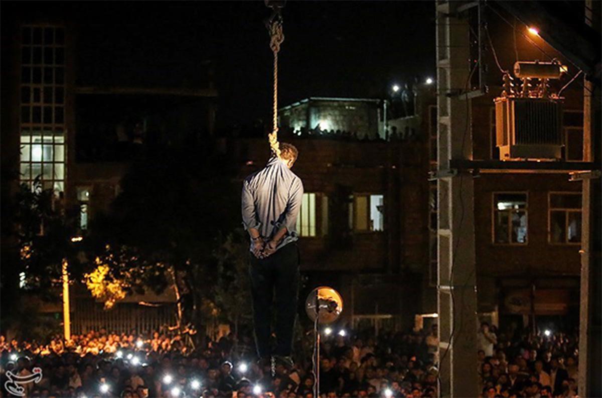 Iran: A public hanging at night.