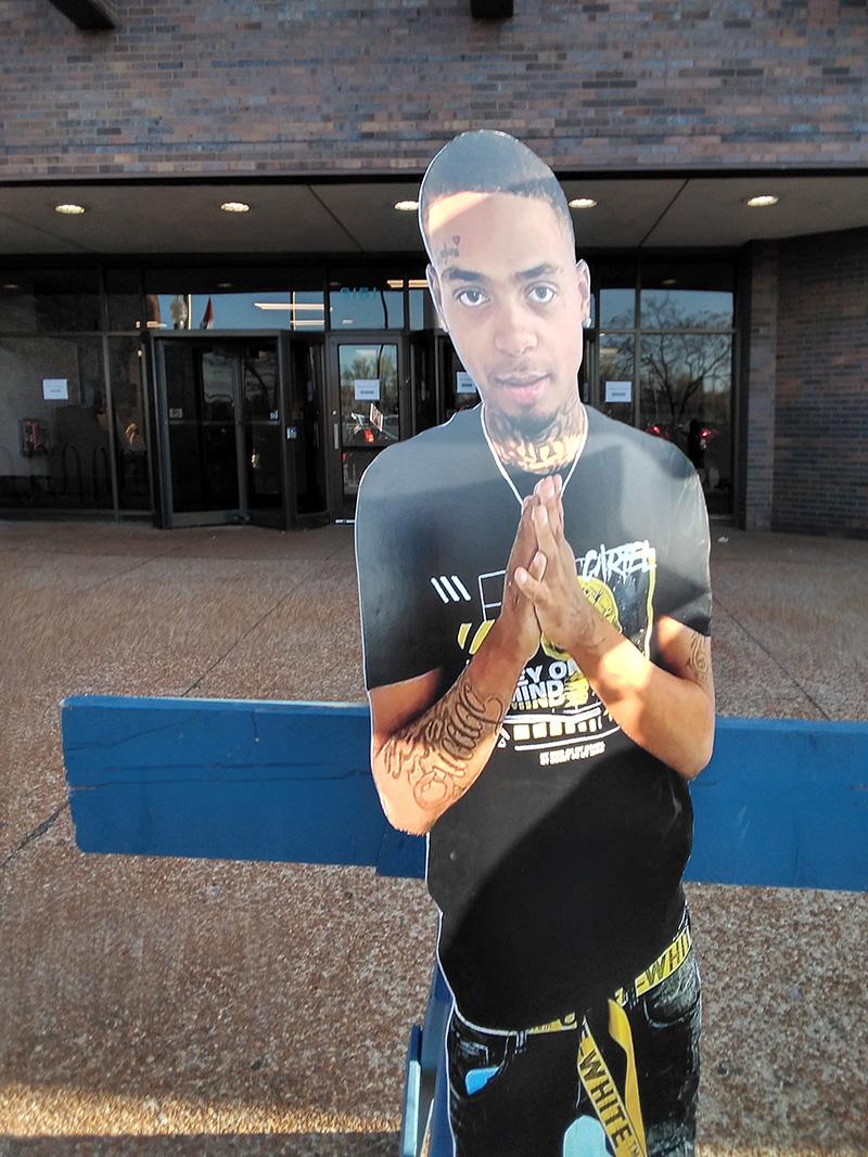 Cardboard image of Reginald Clay, Lil Red, killed by Chicago cops.